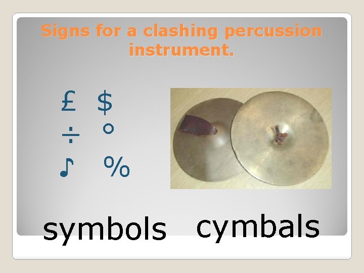 Signs for a clashing percussion instrument. £ $ ÷ ° ♪ % symbols cymbals