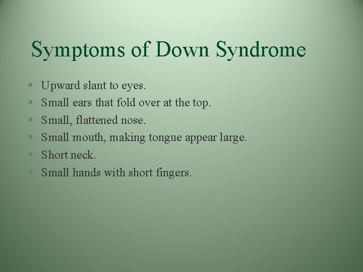Symptoms of Down Syndrome § § § Upward slant to eyes. Small ears that