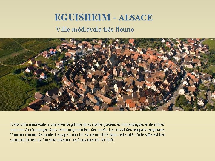 EGUISHEIM - ALSACE Ville médiévale très fleurie Cette ville médiévale a conservé de pittoresques