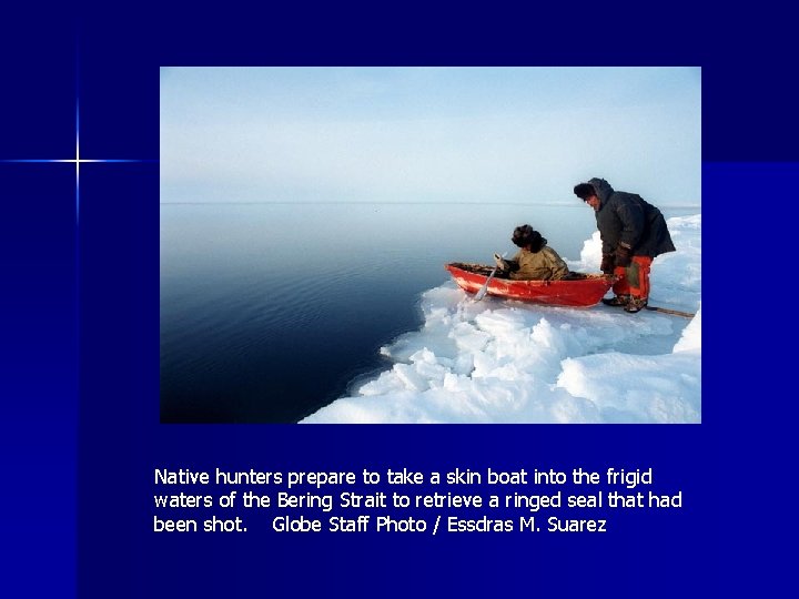 Native hunters prepare to take a skin boat into the frigid waters of the