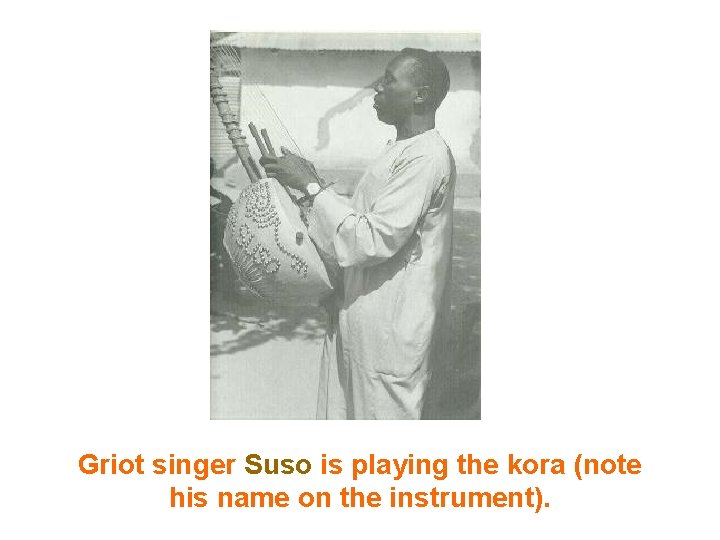 Griot singer Suso is playing the kora (note his name on the instrument). Griot singer Suso is playing the kora (note his name on the instrument).