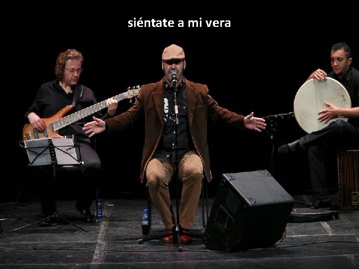 siéntate a mi vera 
