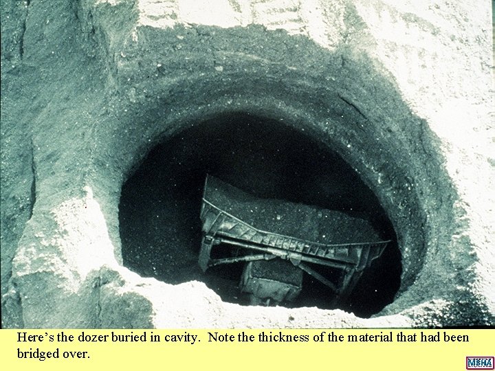 Here’s the dozer buried in cavity. Note thickness of the material that had been Here’s the dozer buried in cavity. Note thickness of the material that had been
