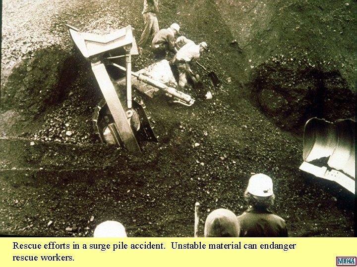 Rescue efforts in a surge pile accident. Unstable material can endanger rescue workers. Rescue efforts in a surge pile accident. Unstable material can endanger rescue workers.