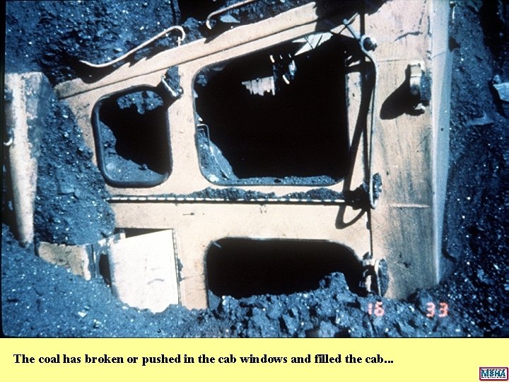 The coal has broken or pushed in the cab windows and filled the cab. The coal has broken or pushed in the cab windows and filled the cab.