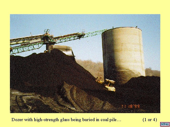 Dozer with high-strength glass being buried in coal pile… (1 or 4) Dozer with high-strength glass being buried in coal pile… (1 or 4)
