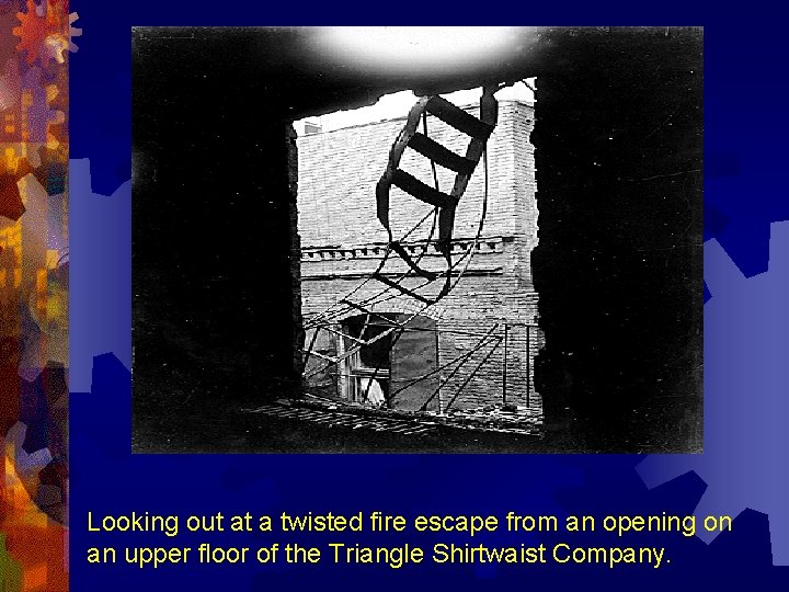 Looking out at a twisted fire escape from an opening on an upper floor