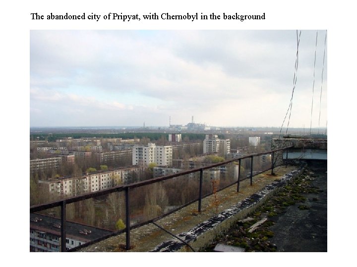 The abandoned city of Pripyat, with Chernobyl in the background 