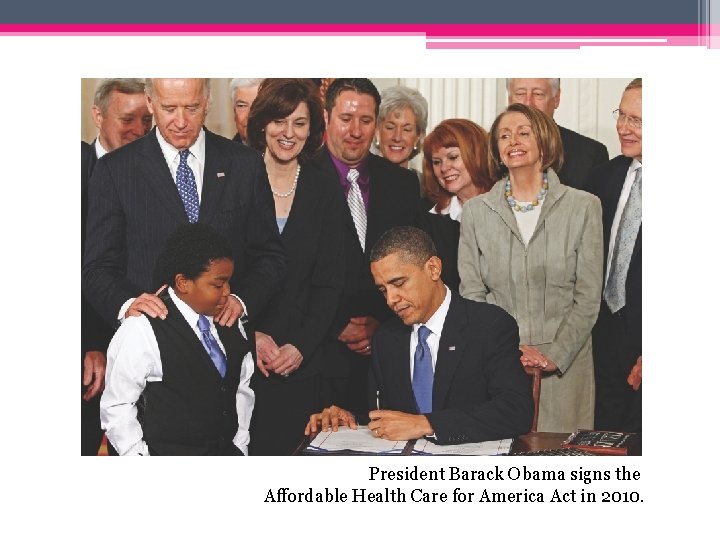 President Barack Obama signs the Affordable Health Care for America Act in 2010. 