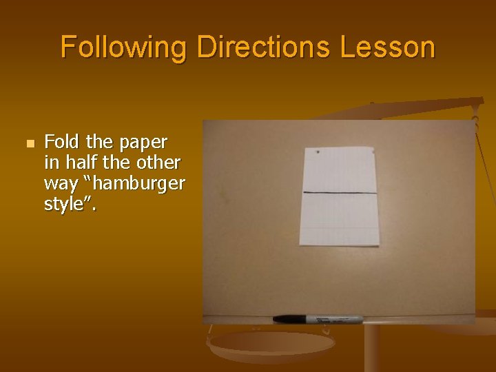 Following Directions Lesson n Fold the paper in half the other way “hamburger style”.