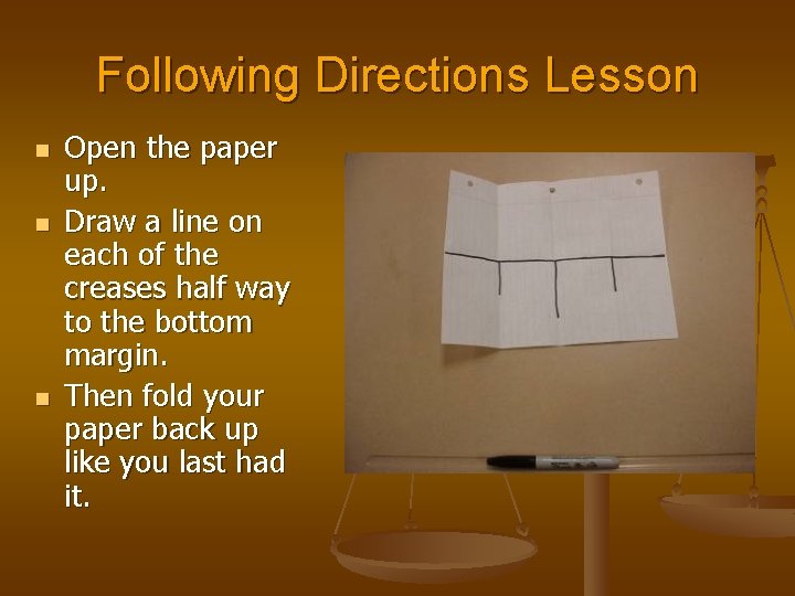 Following Directions Lesson n Open the paper up. Draw a line on each of