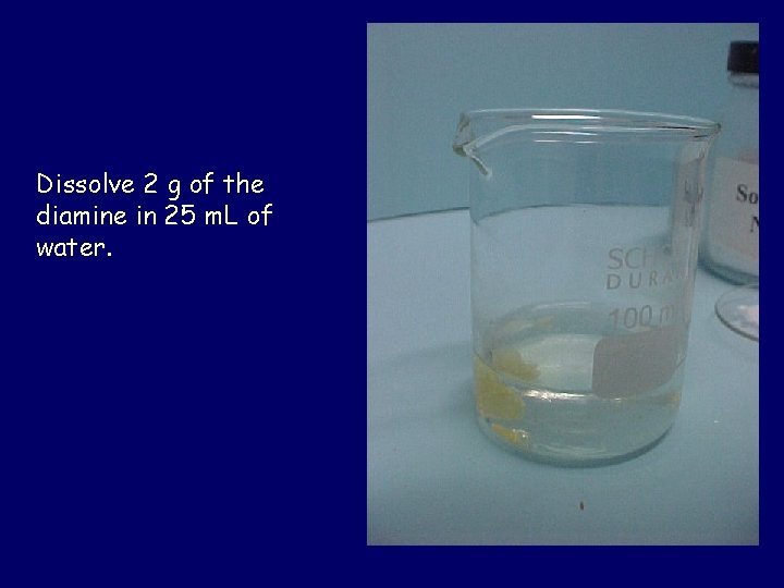 Dissolve 2 g of the diamine in 25 m. L of water. 