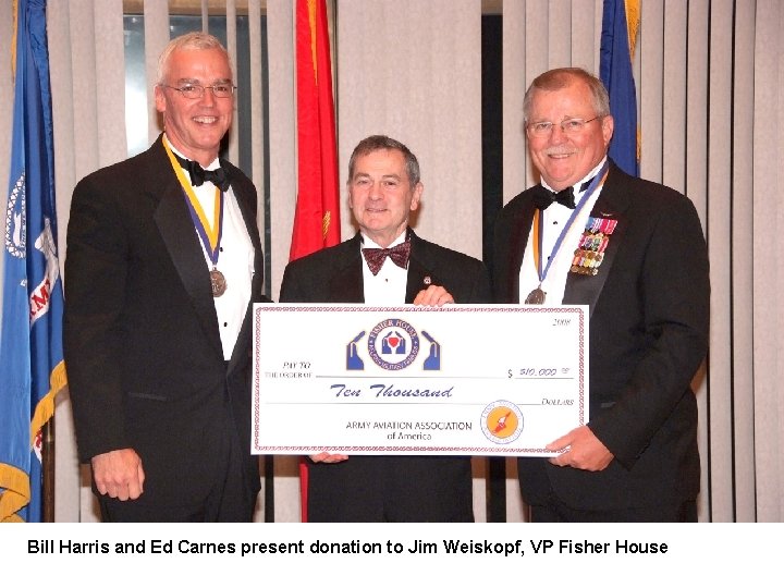 Bill Harris and Ed Carnes present donation to Jim Weiskopf, VP Fisher House 