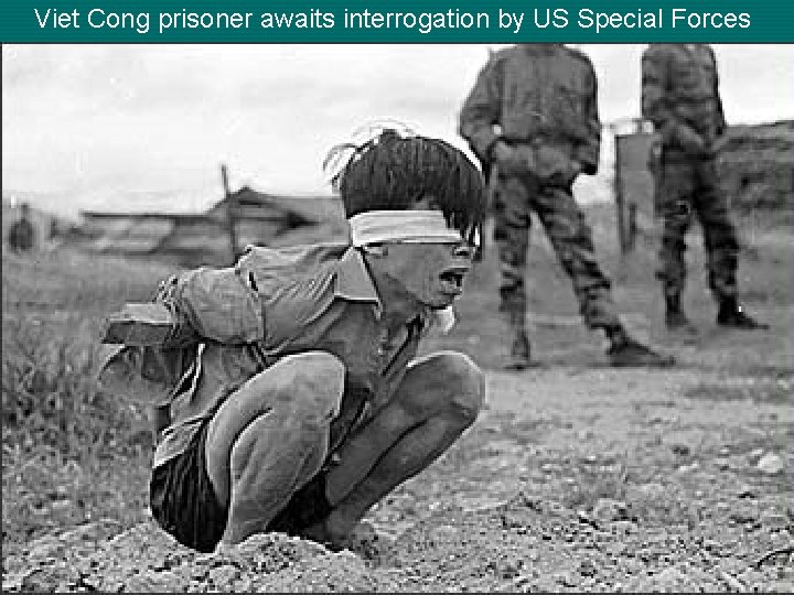 Viet Cong prisoner awaits interrogation by US Special Forces 