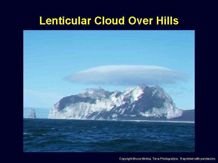 Lenticular Cloud Over Hills Copyright Bruce Molnia, Terra Photograhjcs. Reprinted with permission. 