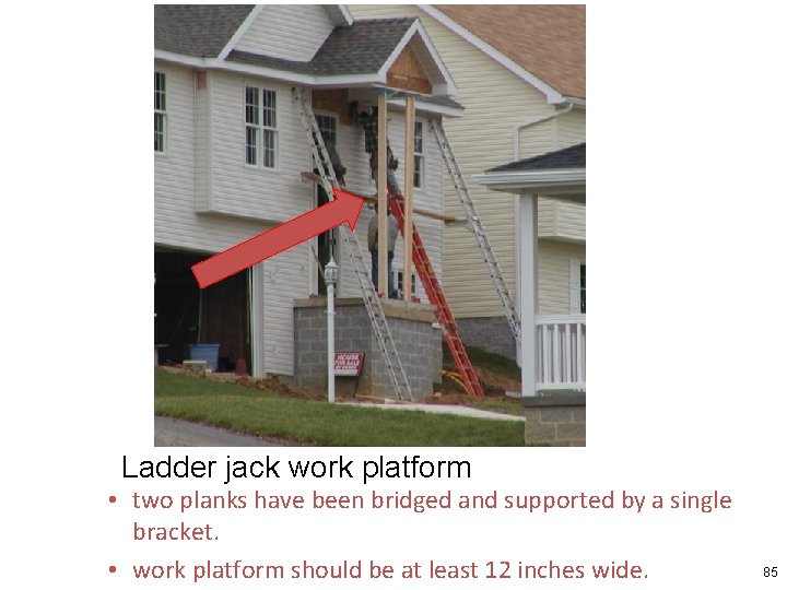 Ladder jack work platform • two planks have been bridged and supported by a