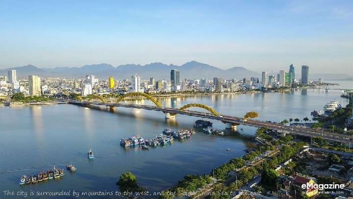 The city is surrounded by mountains to the west, and the South China Sea