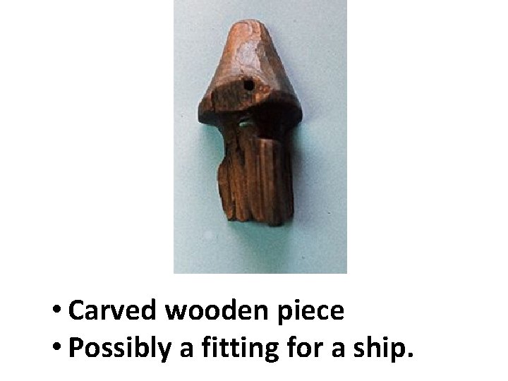  • Carved wooden piece • Possibly a fitting for a ship. 
