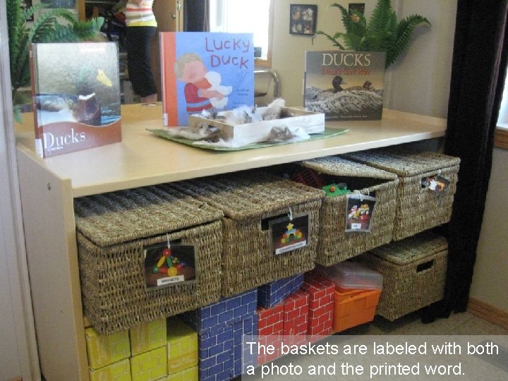 The baskets are labeled with both a photo and the printed word. 