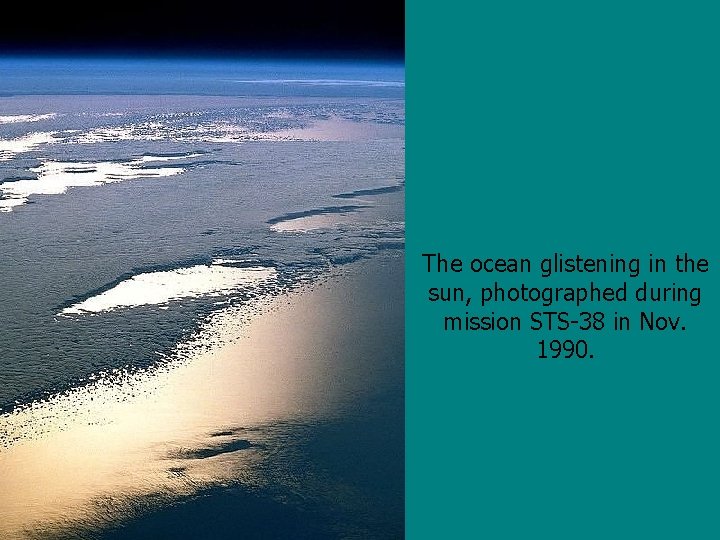 The ocean glistening in the sun, photographed during mission STS-38 in Nov. 1990. 