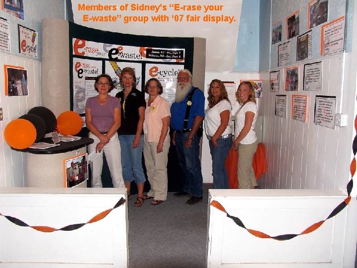 Members of Sidney’s “E-rase your E-waste” group with ‘ 07 fair display. 