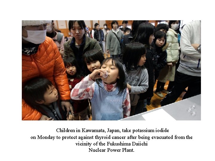 Children in Kawamata, Japan, take potassium iodide on Monday to protect against thyroid cancer