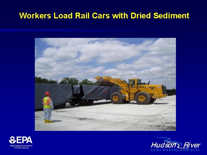 Workers Load Rail Cars with Dried Sediment 