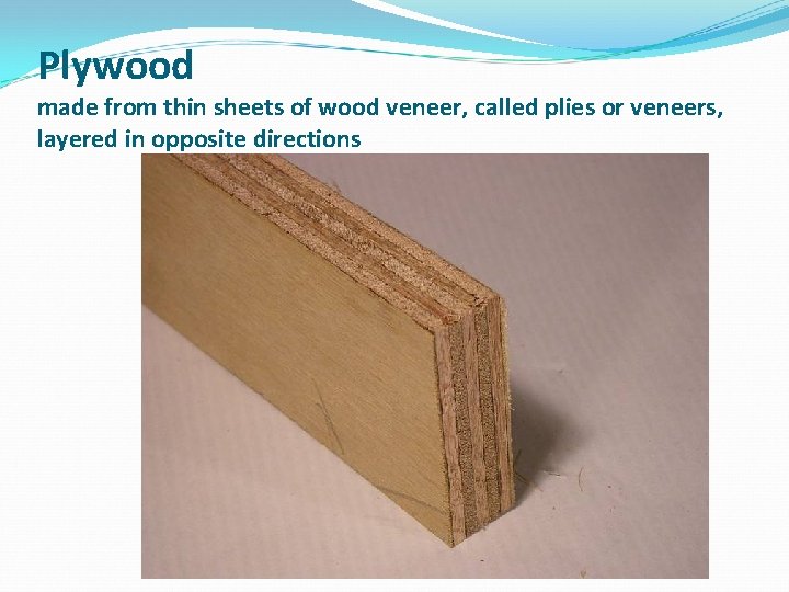 Plywood made from thin sheets of wood veneer, called plies or veneers, layered in