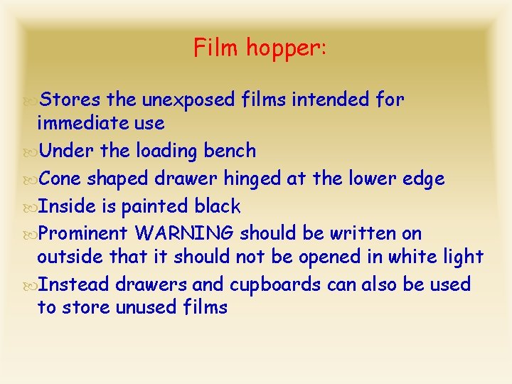 Film hopper: Stores the unexposed films intended for immediate use Under the loading bench