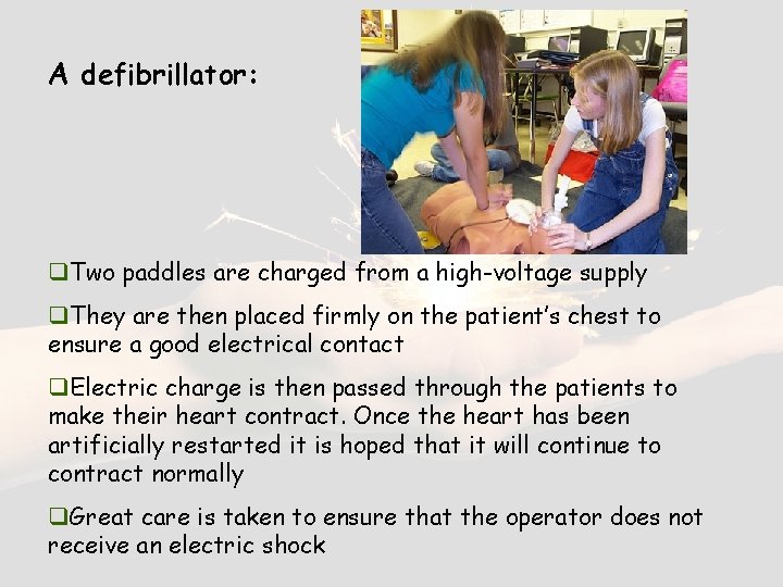 A defibrillator: q. Two paddles are charged from a high-voltage supply q. They are