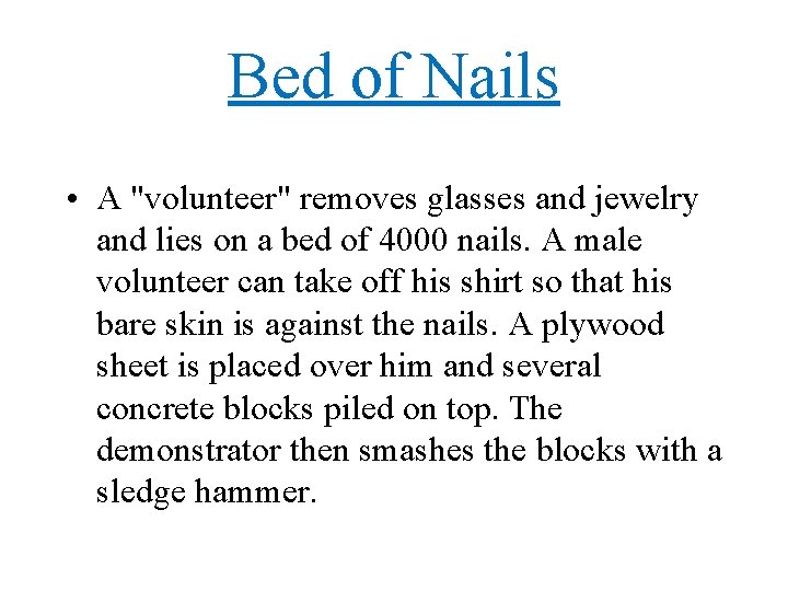 Bed of Nails • A "volunteer" removes glasses and jewelry and lies on a