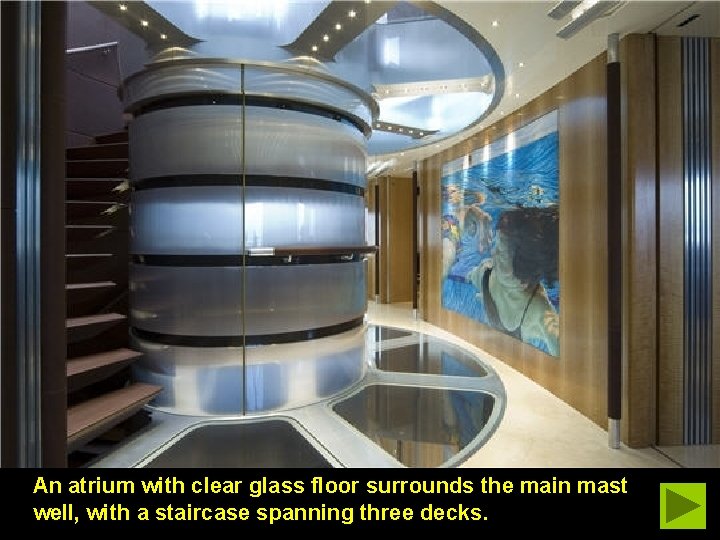 An atrium with clear glass floor surrounds the main mast well, with a staircase