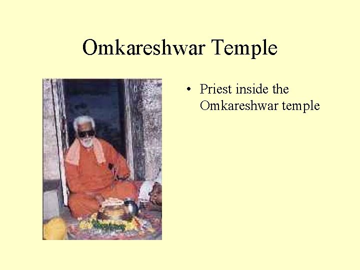 Omkareshwar Temple • Priest inside the Omkareshwar temple 