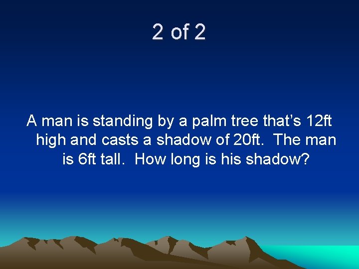 2 of 2 A man is standing by a palm tree that’s 12 ft