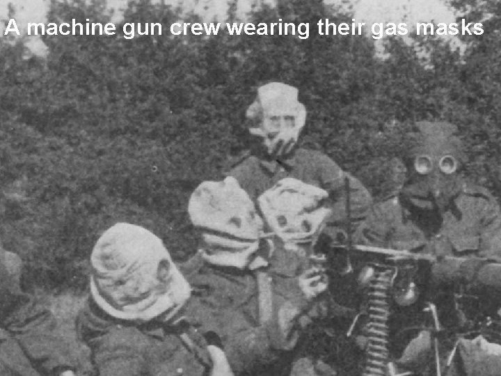 A machine gun crew wearing their gas masks 