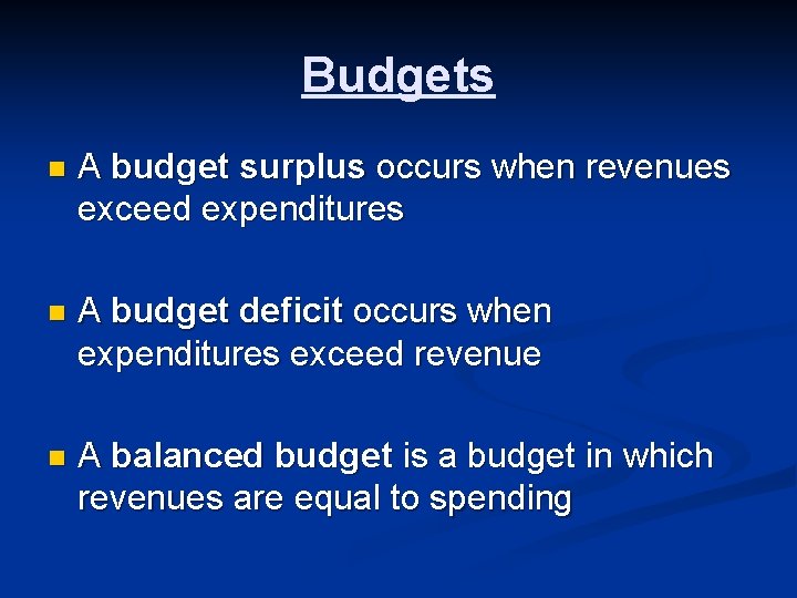 Budgets n A budget surplus occurs when revenues exceed expenditures n A budget deficit