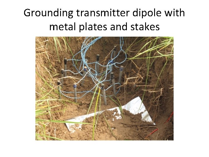 Grounding transmitter dipole with metal plates and stakes 