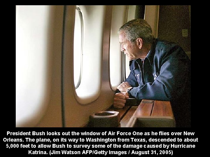 President Bush looks out the window of Air Force One as he flies over