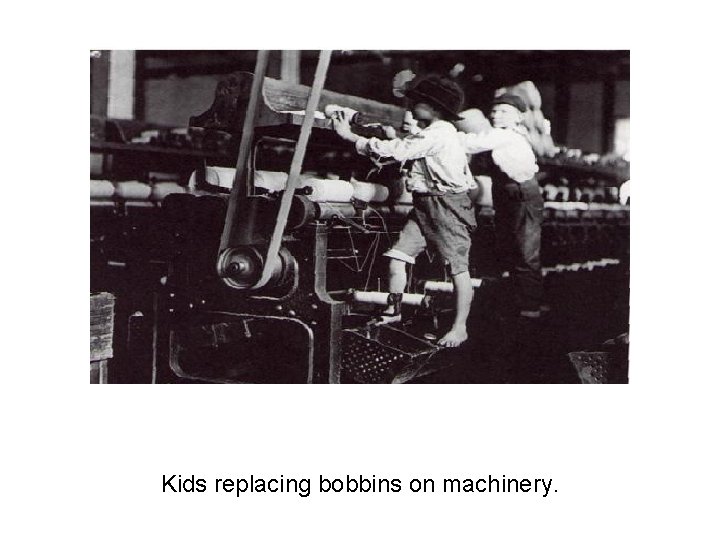 Kids replacing bobbins on machinery. 