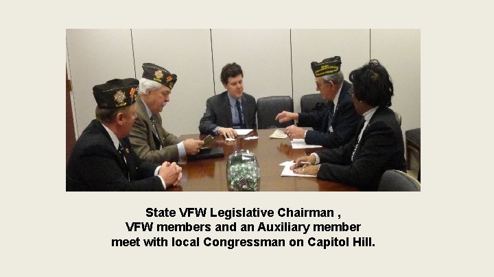 State VFW Legislative Chairman , VFW members and an Auxiliary member meet with local