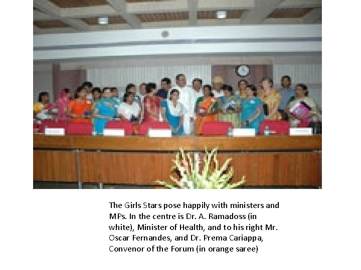 The Girls Stars pose happily with ministers and MPs. In the centre is Dr.