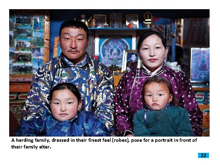 A herding family, dressed in their finest feel (robes), pose for a portrait in