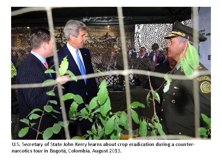 U. S. Secretary of State John Kerry learns about crop eradication during a counternarcotics