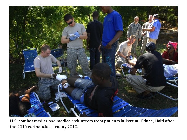 U. S. combat medics and medical volunteers treat patients in Port-au-Prince, Haiti after the