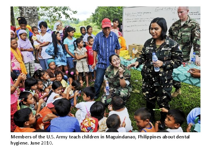 Members of the U. S. Army teach children in Maguindanao, Philippines about dental hygiene.