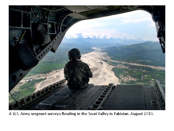 A U. S. Army sergeant surveys flooding in the Swat Valley in Pakistan. August