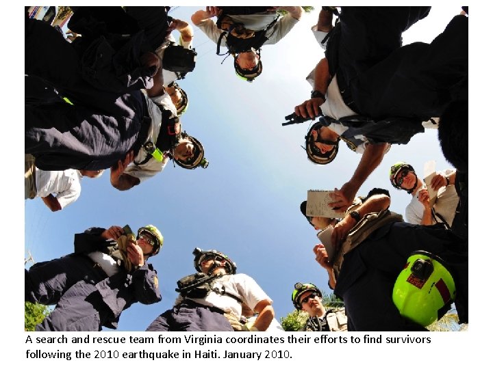 A search and rescue team from Virginia coordinates their efforts to find survivors following