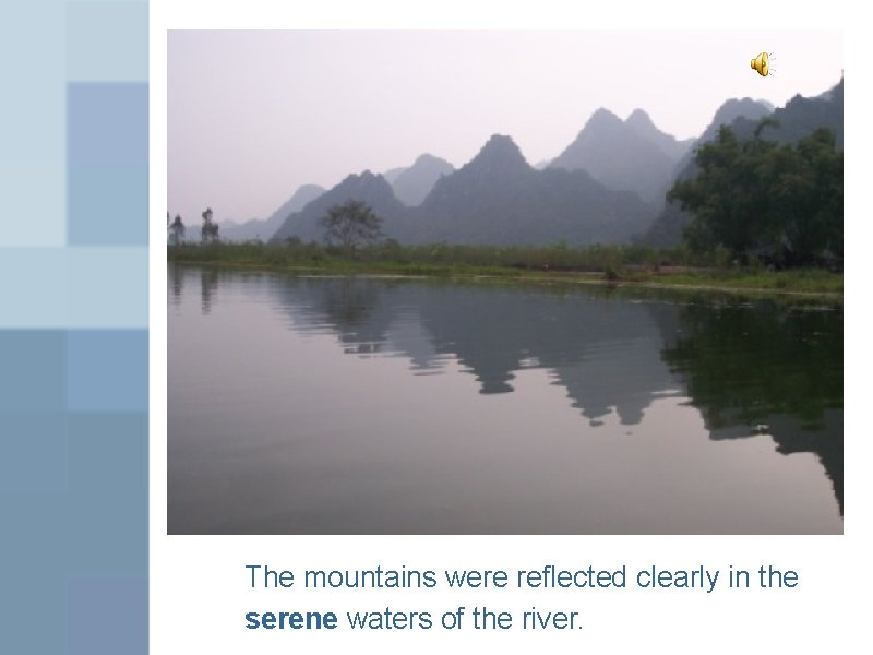 The mountains were reflected clearly in the serene waters of the river. 