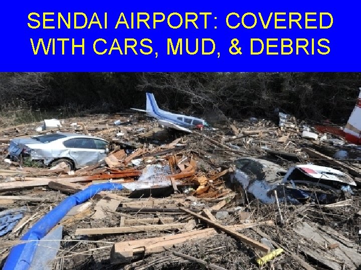 SENDAI AIRPORT: COVERED WITH CARS, MUD, & DEBRIS 