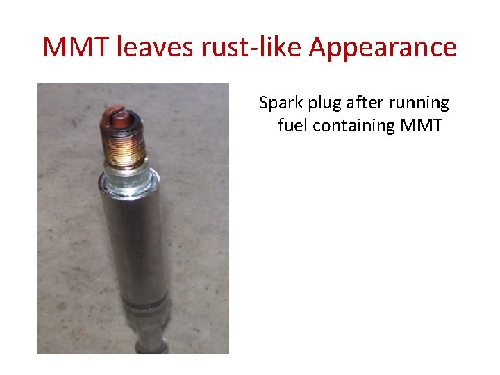 MMT leaves rust-like Appearance Spark plug after running fuel containing MMT 